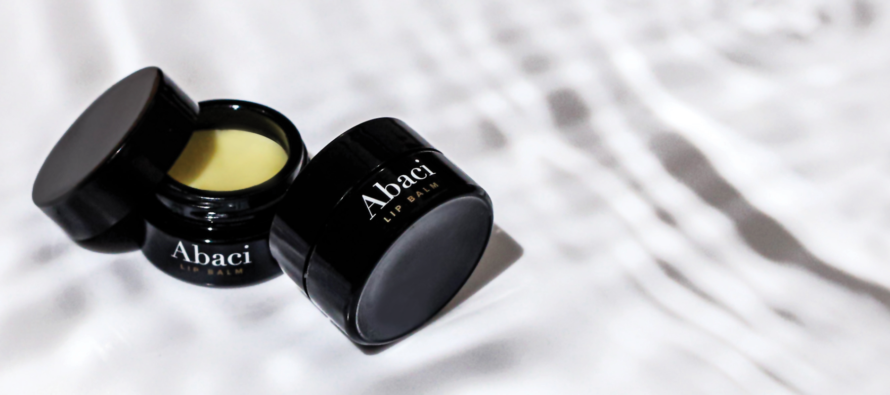 Abaci Organic Lip Balm - Hyaluronic Acid Benefits in Lips - Multiple molecular weights of hyaluronic acid to protect, nourish and deeply moisturize lips.